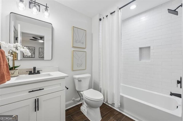 full bathroom featuring toilet, vanity, and shower / bathtub combination with curtain