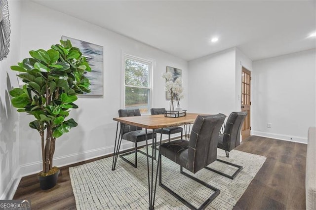 dining space featuring dark hardwood / wood-style floors