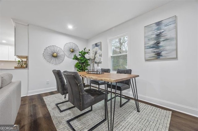 dining room with dark hardwood / wood-style floors