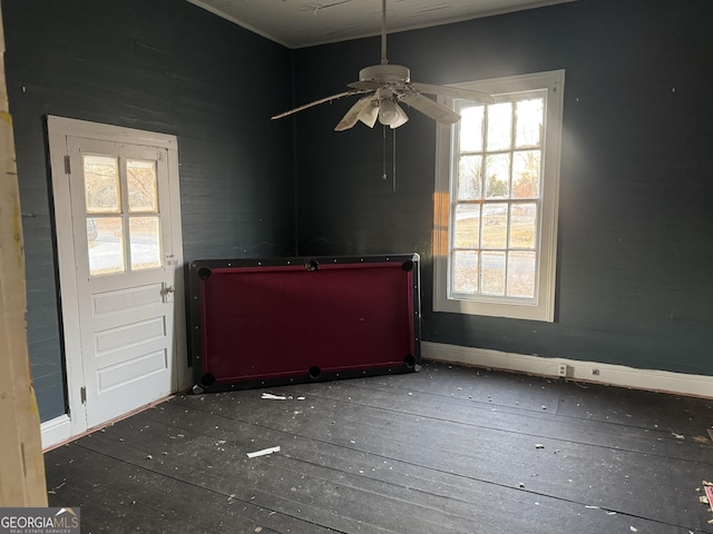 unfurnished room featuring ceiling fan and a healthy amount of sunlight