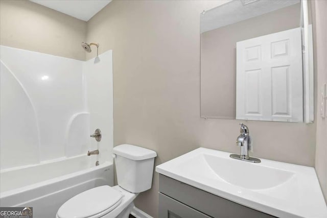 full bathroom with vanity, shower / washtub combination, and toilet