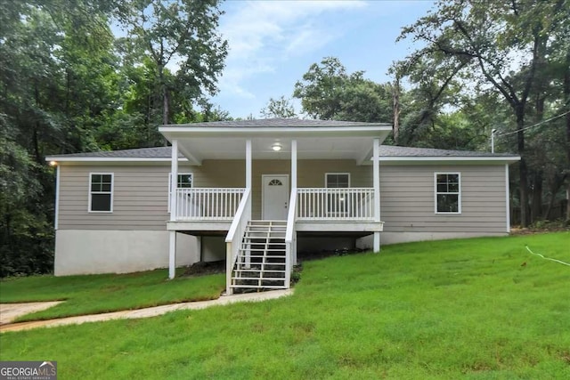 view of front of property featuring covered porch and a front lawn