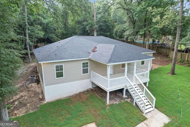 exterior space with cooling unit and a front yard