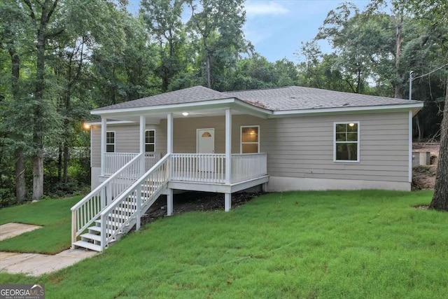 view of front of home featuring a porch and a front lawn