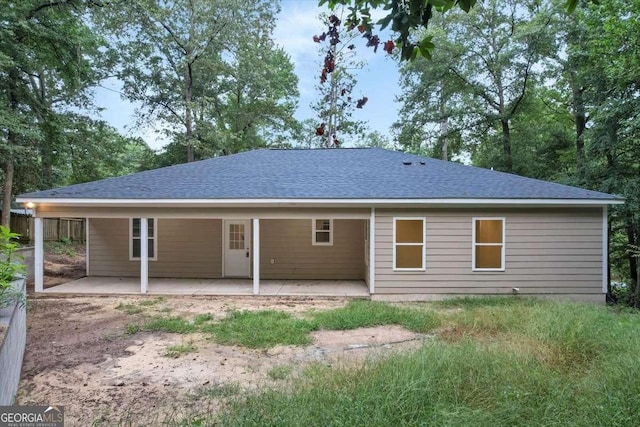 rear view of property featuring a patio