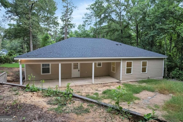 back of property with a patio area