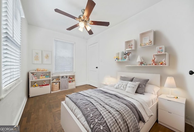 bedroom featuring dark wood-type flooring and ceiling fan