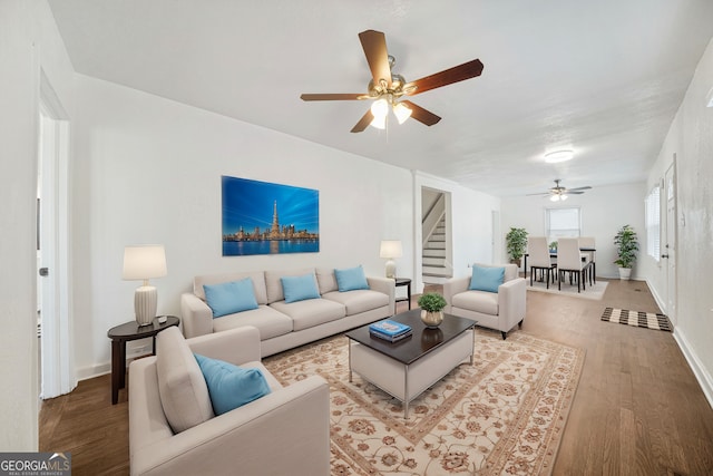 living room with hardwood / wood-style flooring and ceiling fan