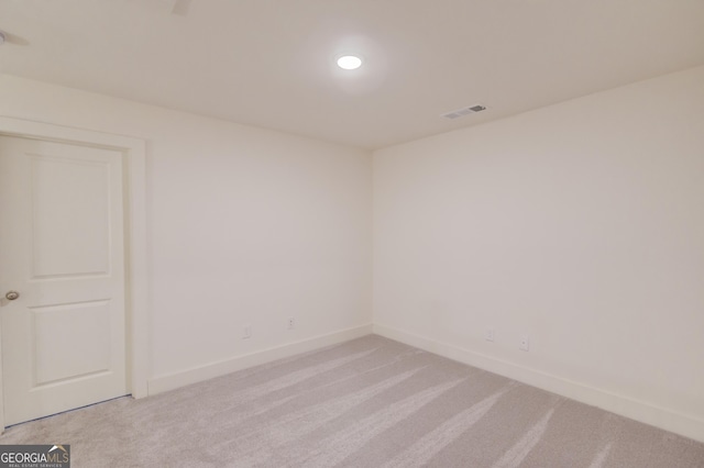 empty room featuring light carpet