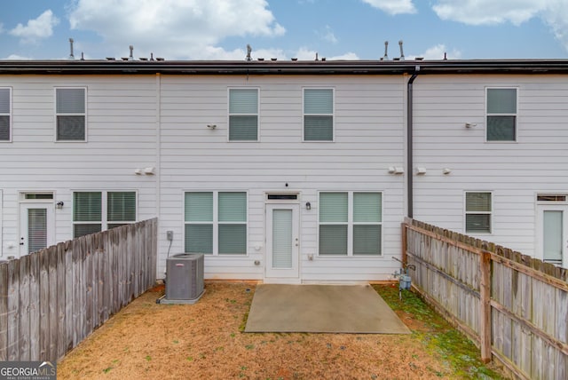 back of house with a patio area and central air condition unit