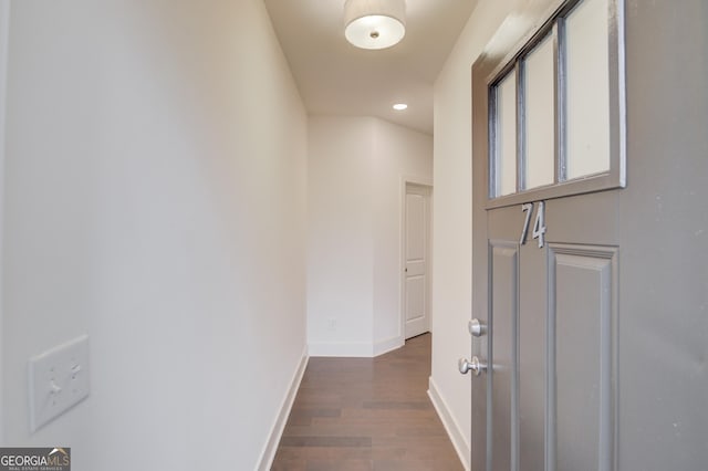 hall with dark hardwood / wood-style flooring