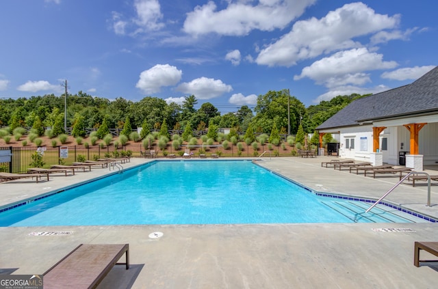 view of pool featuring a patio