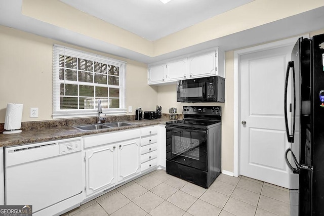 kitchen featuring sink, light tile patterned floors, white cabinets, and black appliances