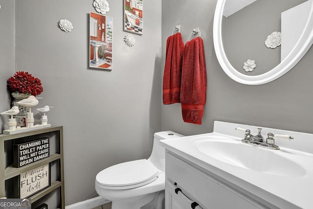 bathroom featuring vanity and toilet