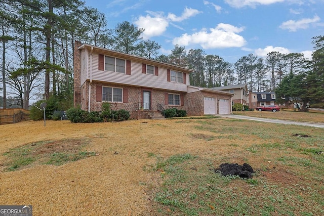 view of front of house with a garage and a front yard