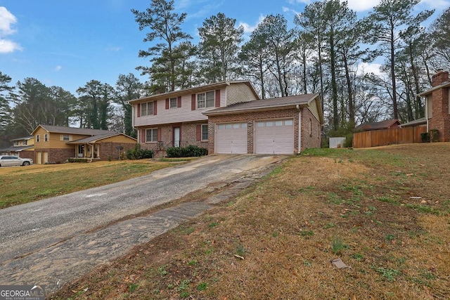 front of property featuring a garage and a front yard