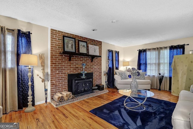 living room featuring hardwood / wood-style flooring and a textured ceiling