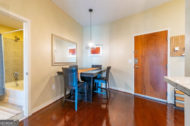 dining room with dark wood-type flooring