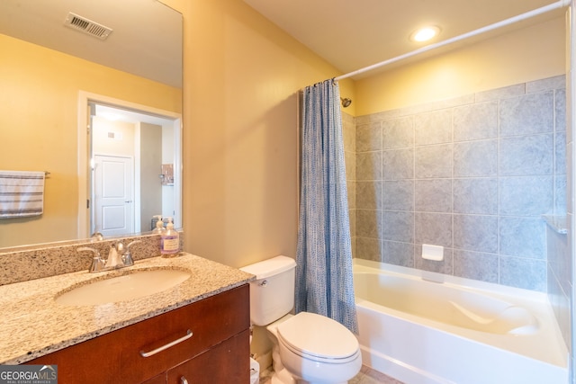 full bathroom featuring shower / tub combo, vanity, and toilet