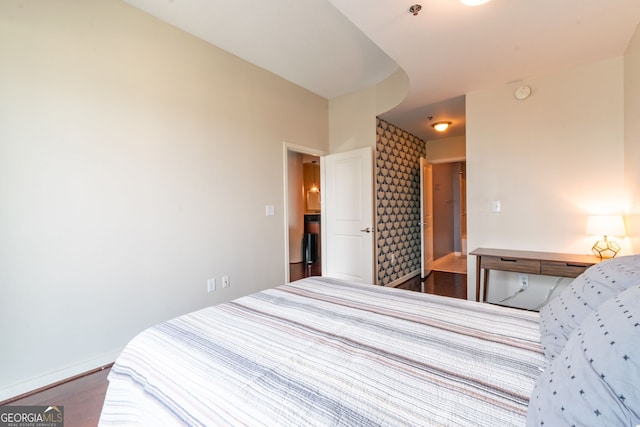 bedroom featuring dark hardwood / wood-style flooring