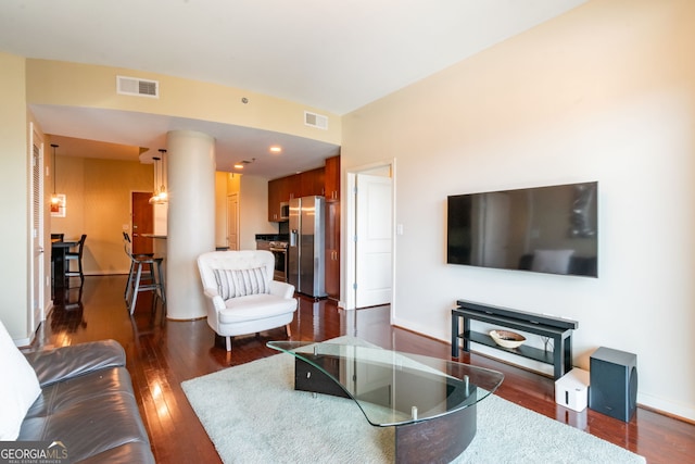 living room with dark hardwood / wood-style floors