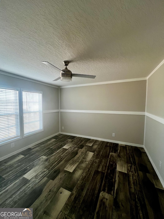 unfurnished room featuring ceiling fan, dark wood-type flooring, and a textured ceiling