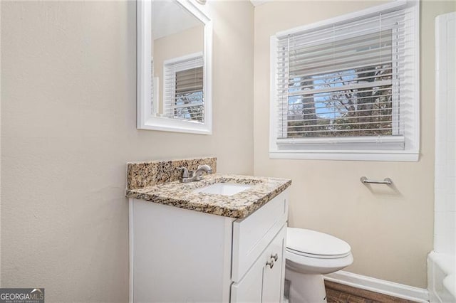 bathroom featuring vanity and toilet