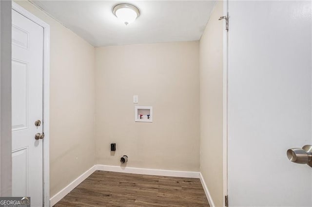 washroom with dark hardwood / wood-style floors and washer hookup