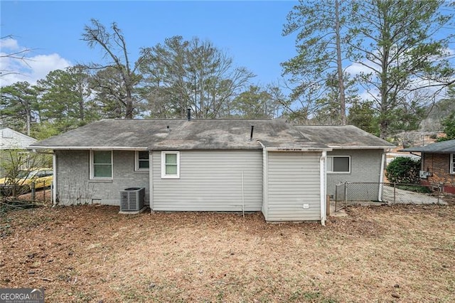 rear view of house with central air condition unit