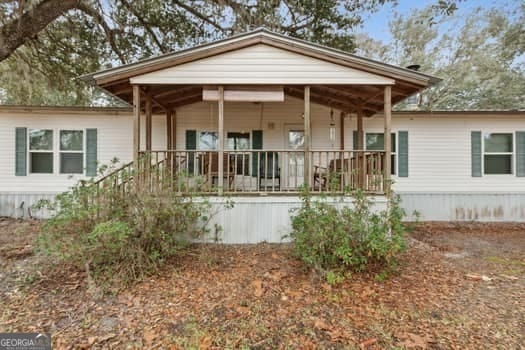 back of house with covered porch