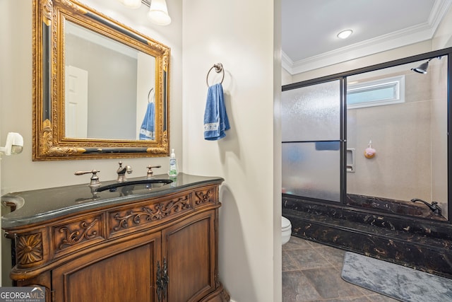 bathroom featuring ornamental molding, vanity, and toilet