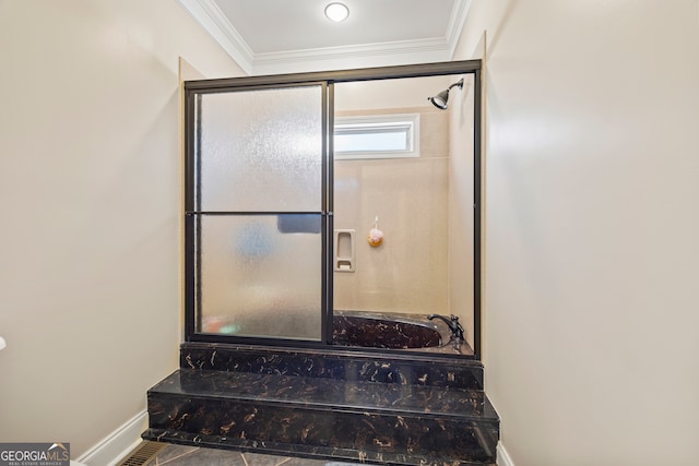 bathroom featuring ornamental molding and a bathing tub