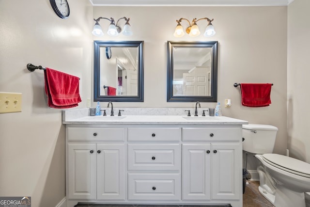 bathroom featuring vanity, tile patterned floors, and toilet