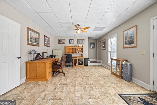 office featuring a drop ceiling and ceiling fan