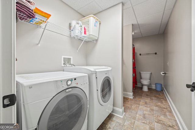 laundry area featuring washing machine and clothes dryer