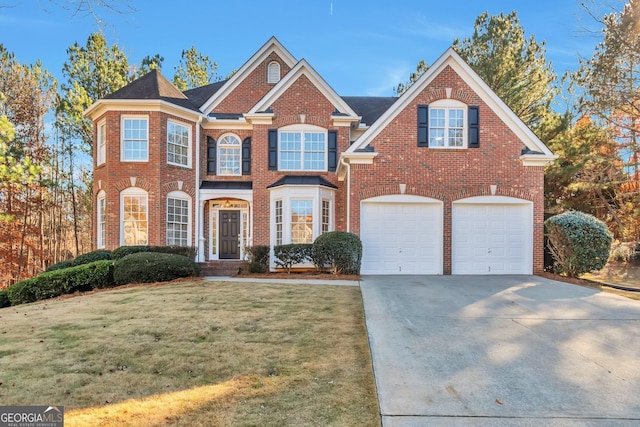 view of property featuring a garage and a front yard