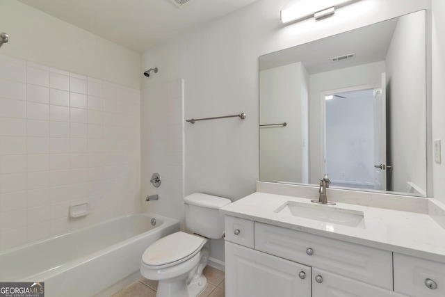 full bathroom with  shower combination, toilet, tile patterned flooring, and vanity