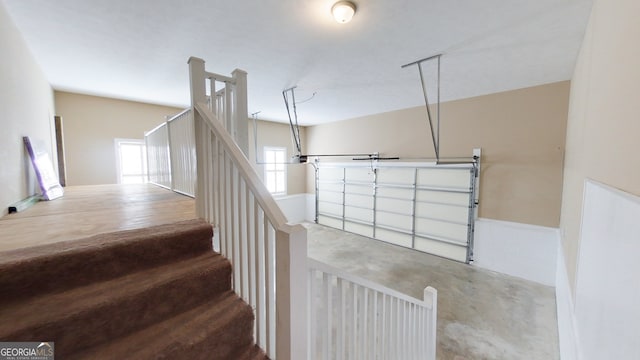 stairway with concrete flooring