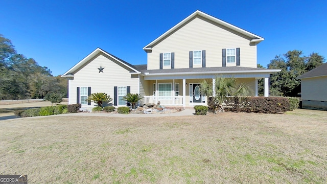 view of front facade with covered porch and a front lawn