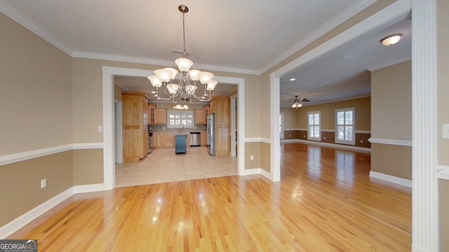 unfurnished dining area with crown molding, ceiling fan with notable chandelier, and light hardwood / wood-style floors