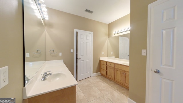 101 Willow Ridge Cir, Thomasville, GA 31757 - bathroom with two vanities, tile patterned flooring, and baseboards