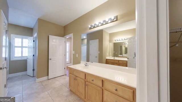 101 Willow Ridge Cir, Thomasville, GA 31757 - bathroom featuring a closet, vanity, tile patterned floors, and baseboards
