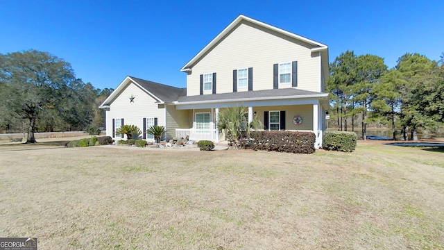 view of front of property featuring a porch and a front yard