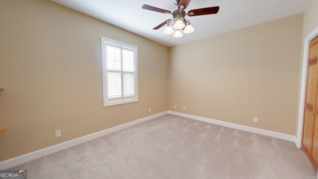 unfurnished bedroom featuring light carpet and ceiling fan