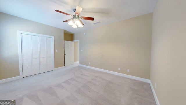 101 Willow Ridge Cir, Thomasville, GA 31757 - unfurnished bedroom featuring a closet, light colored carpet, baseboards, and ceiling fan