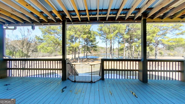 wooden terrace with a water view