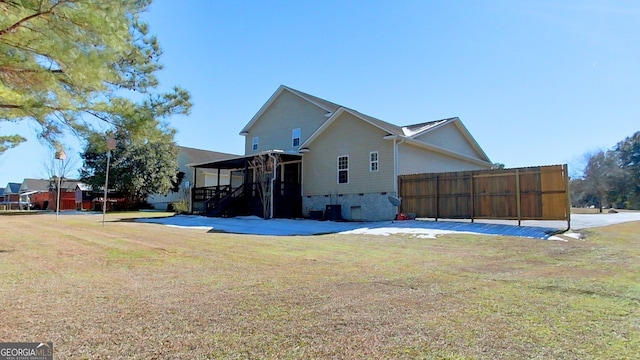 view of home's exterior with a lawn