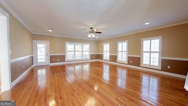 unfurnished living room featuring crown molding, light hardwood / wood-style flooring, and a healthy amount of sunlight