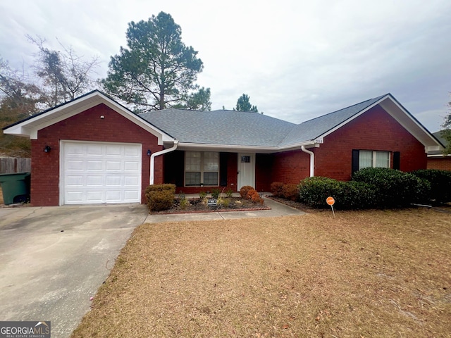 ranch-style home featuring a garage