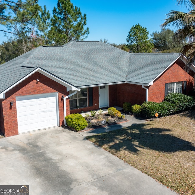 305 Clairemore Cir, Hinesville, GA 31313 - ranch-style home featuring brick siding, an attached garage, roof with shingles, and driveway